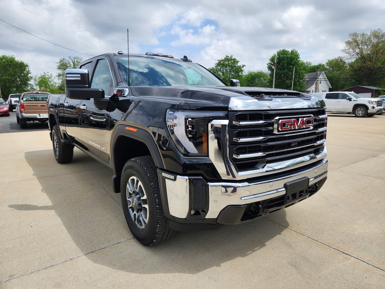 2026 GMC Sierra 3500 HD SLT in Onyx Black — front three-quarter view