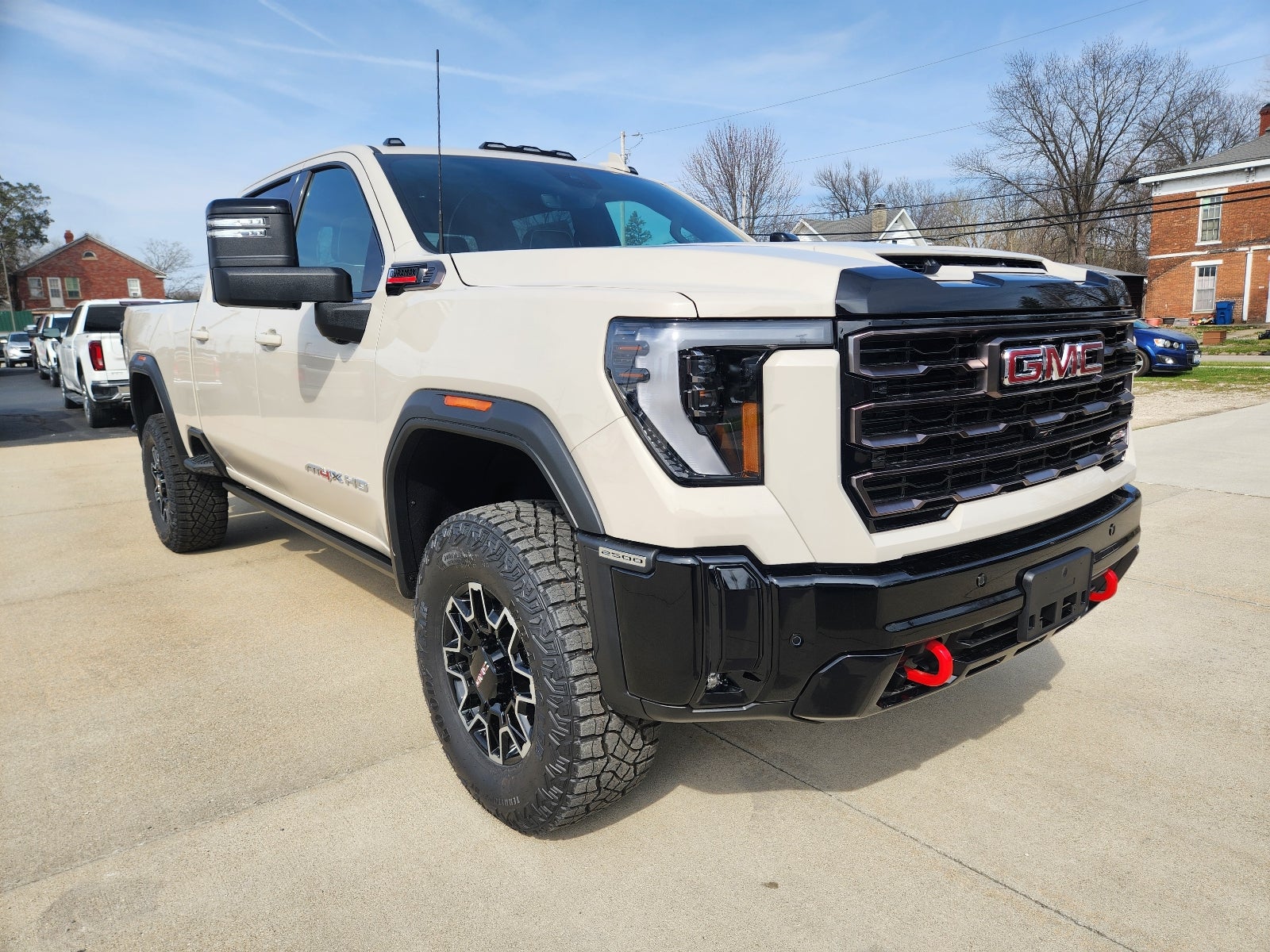2026 GMC Sierra 2500 HD AT4X in Coastal Dune — front three-quarter view