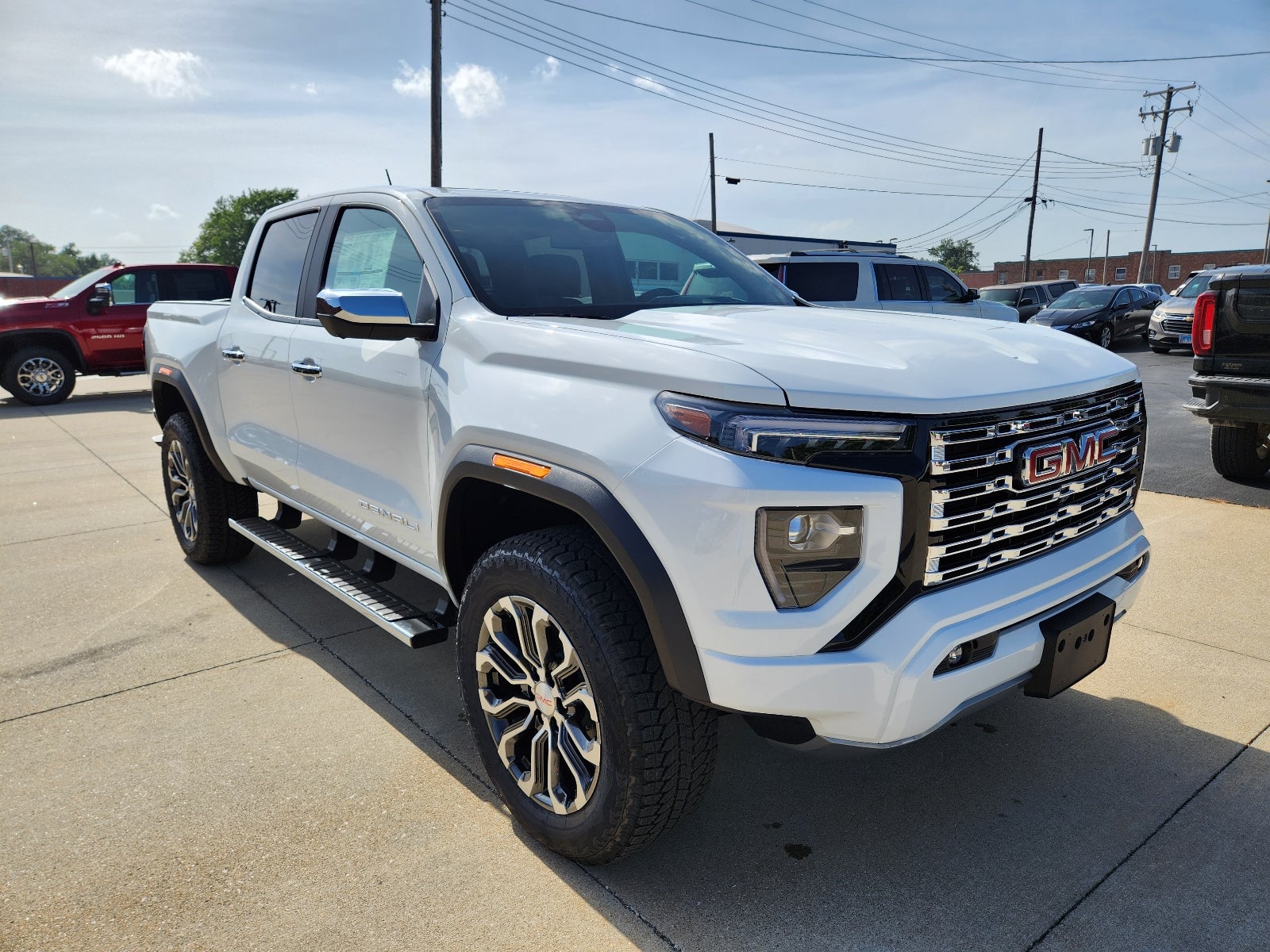 2026 GMC Canyon Denali in Summit White — front three-quarter view