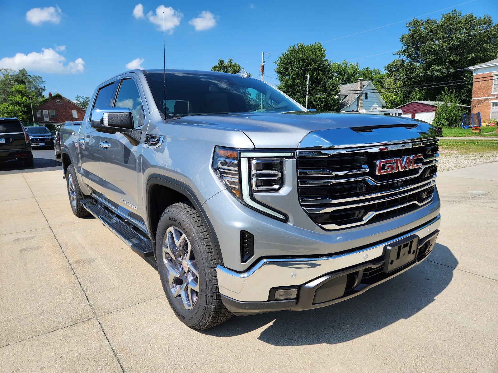 2026 GMC Sierra 1500 SLT in Sterling Metallic — front three-quarter view