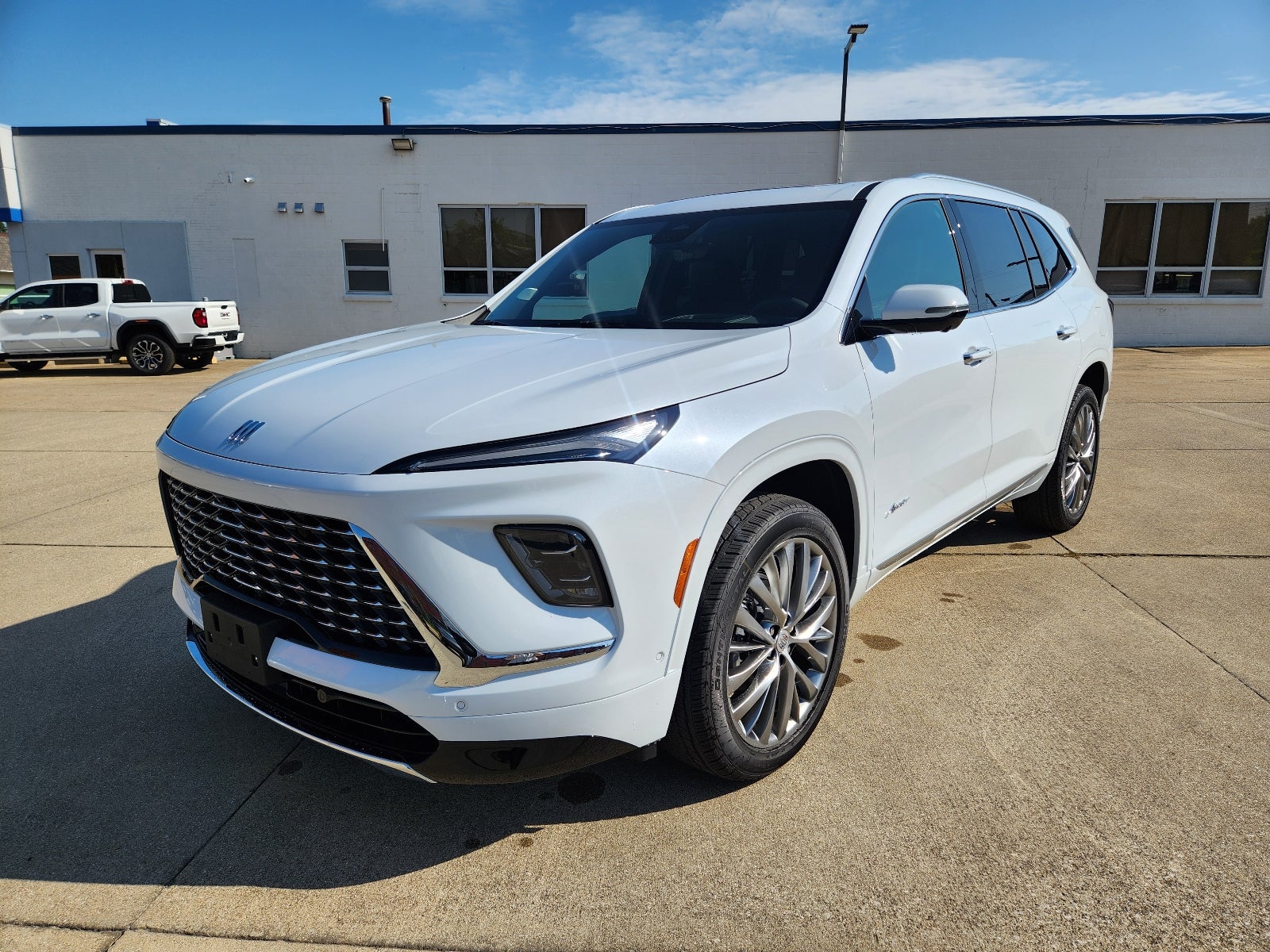 2026 Buick Enclave Avenir in Iridescent White Tricoat — front three-quarter view