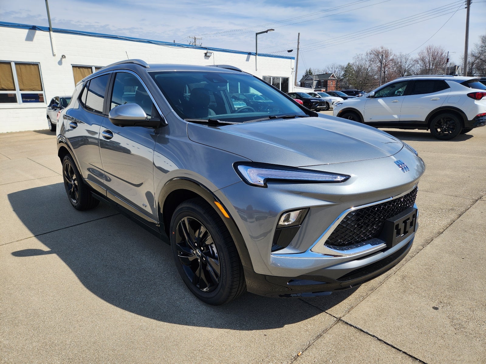 2026 Buick Encore GX Sport Touring in Moonstone Gray Metallic — front three-quarter view
