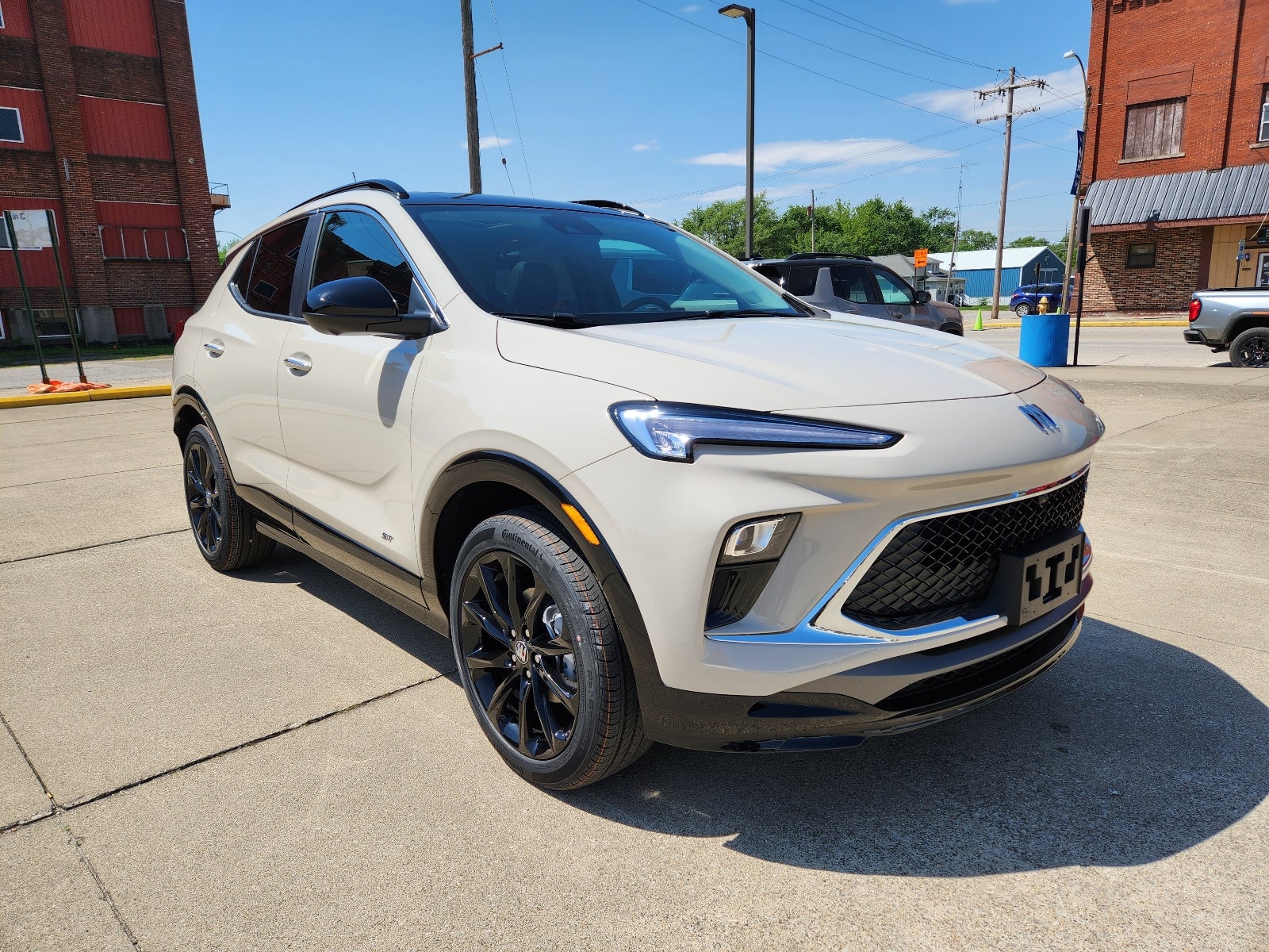 2026 Buick Encore GX Sport Touring in Ceramic — front three-quarter view