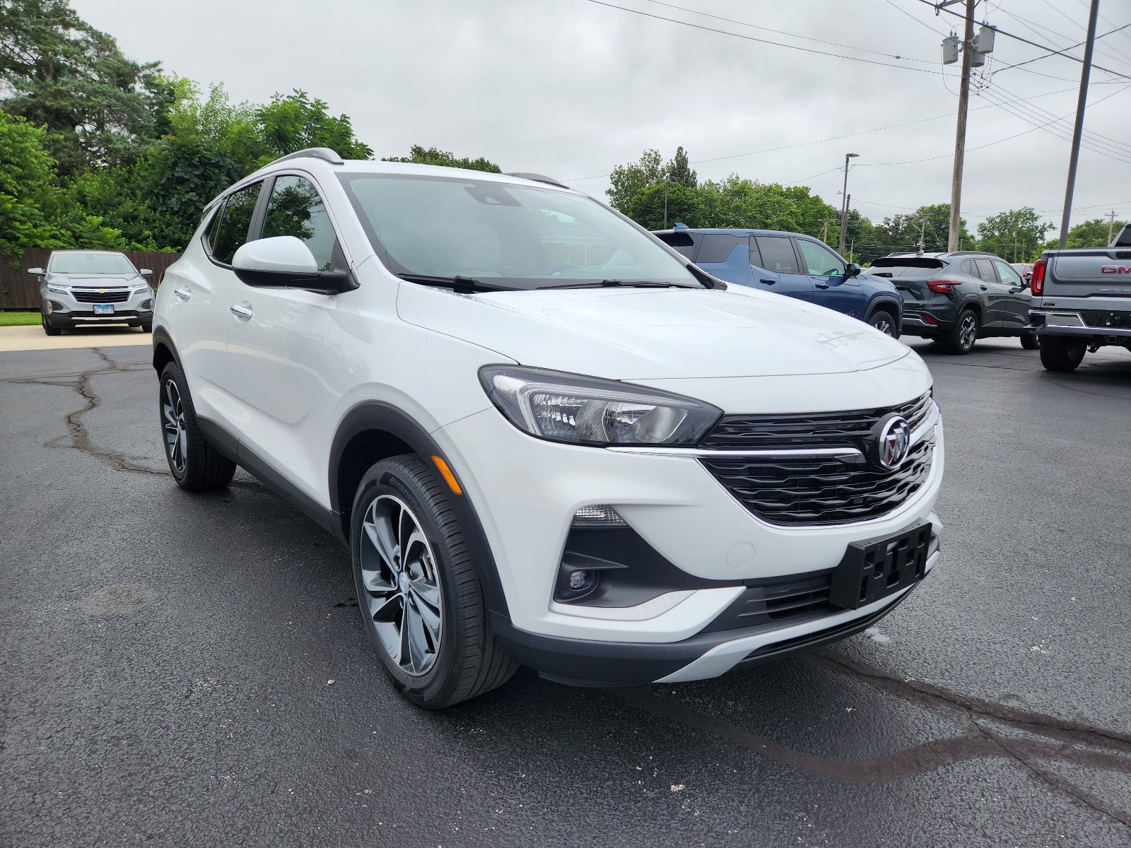 2023 Buick Encore GX Select in Summit White — front three-quarter view