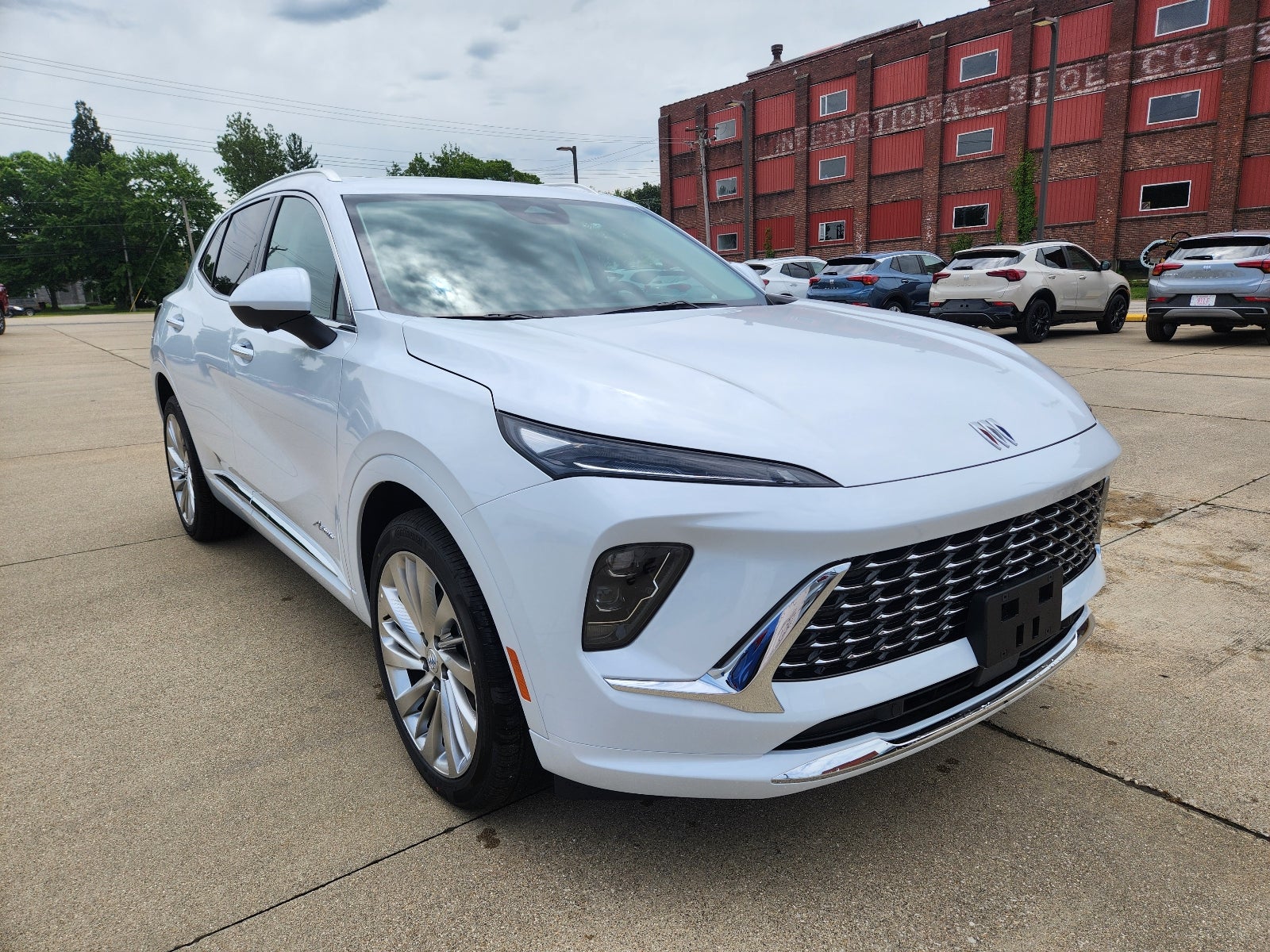 2026 Buick Envision Avenir in Iridescent White Tricoat — front three-quarter view